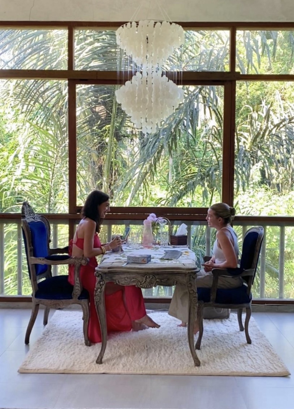 MAÏA reading tarot for a client in her Ubud jungle villa