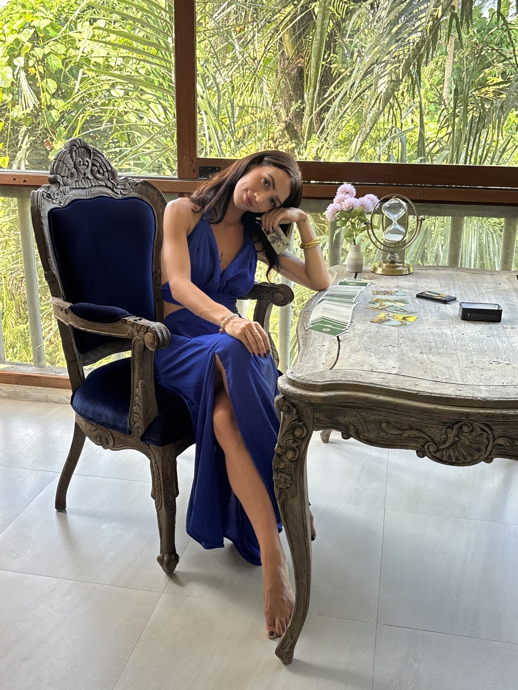 MAÏA seated at her reading table in the Ubud salon